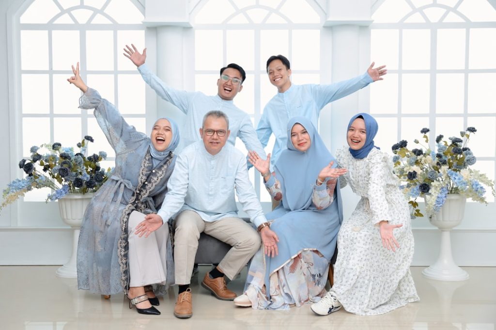 Happy Muslim family posing together representing khandani background in a rishta biodata
